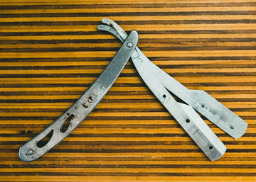 silver scissors on brown wooden table