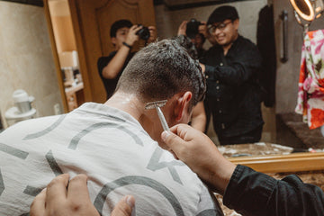 Man getting a close shave with a razor